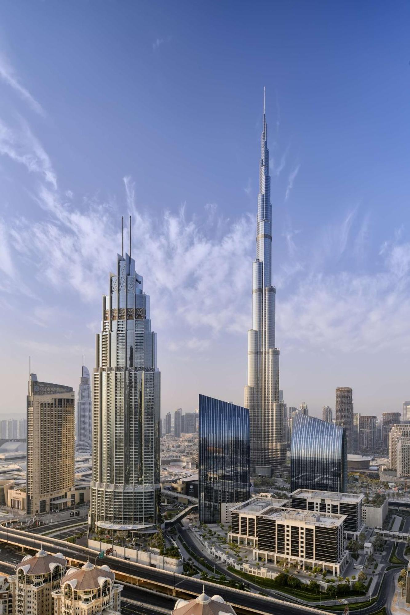 Kempinski The Boulevard Dubai Ngoại thất bức ảnh The tower (right) with the Burj Khalifa (left)